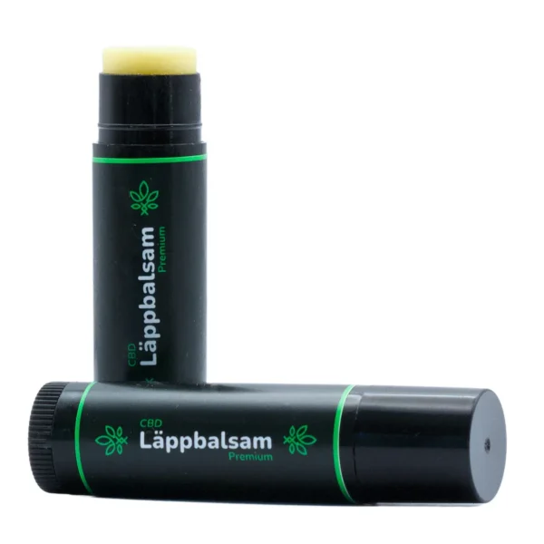 hampablomman cbd lappbalsam premium 1 Svart läppbalsam med gröna detaljer